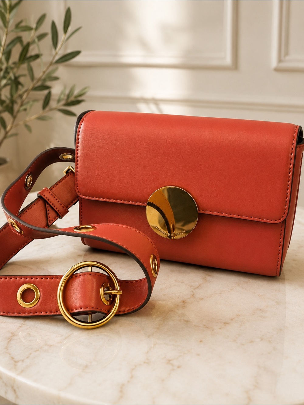 Charles & Keith Coral Leather Crossbody Bag with Gold Disc
